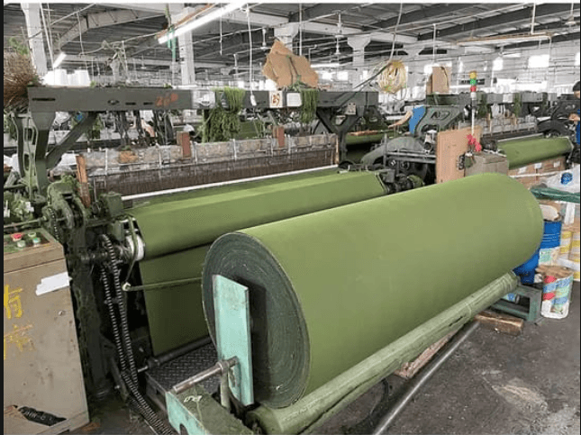Loom in operation, warp beam in focus, low side light